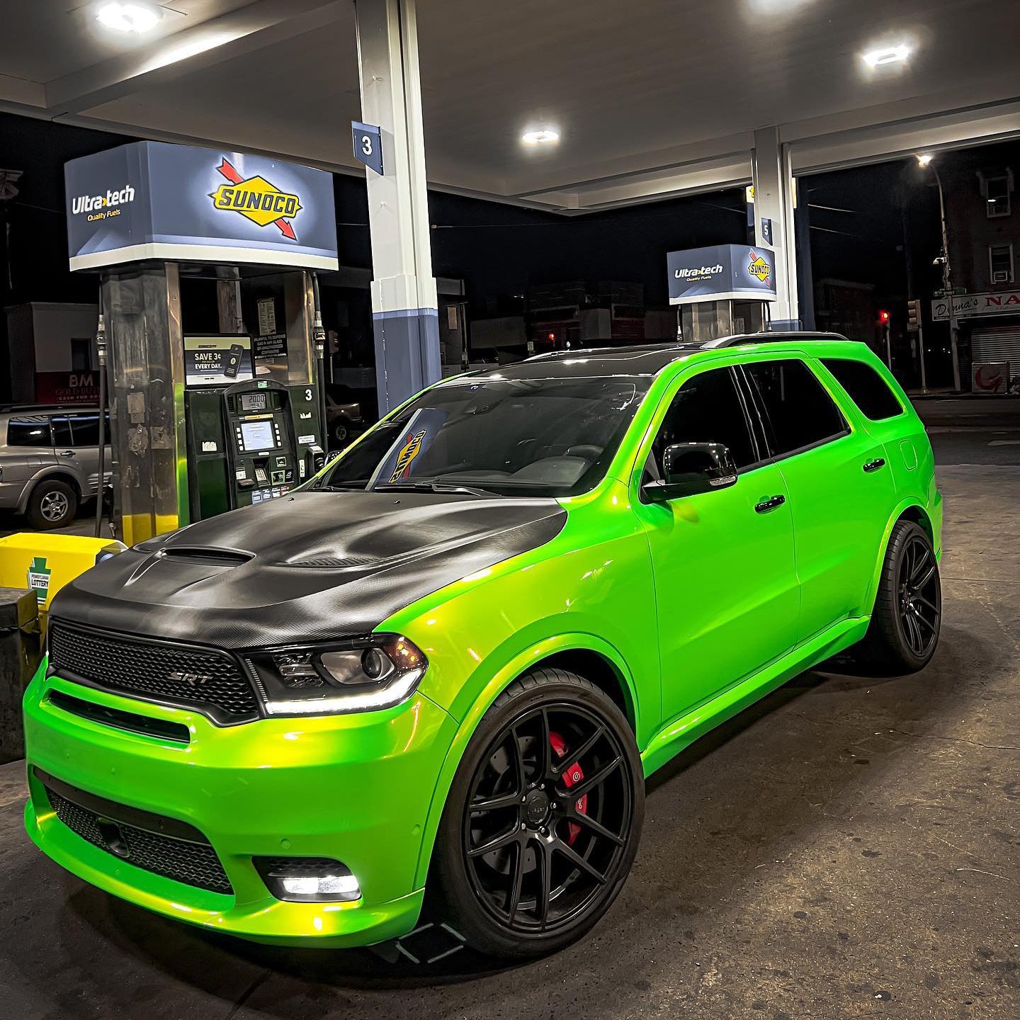 Dodge Durango wrapped in Candy Metallic Neon Green vinyl wrap.