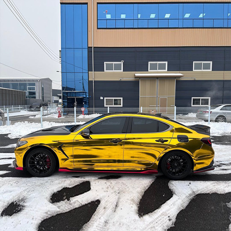 Genesis G70 wrapped in Mirror Chrome Gold vinyl wrap.