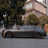 Mercedes-Benz E-Class wrapped in Matte AMG Gray Vinyl Wrap on road.