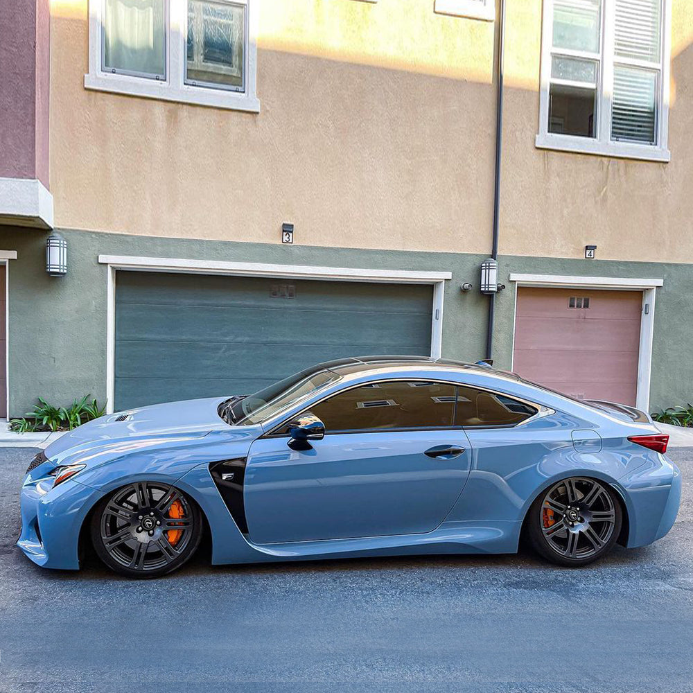 Lexus RC F wrapped in Super Glossy China Blue vinyl wrap door view.