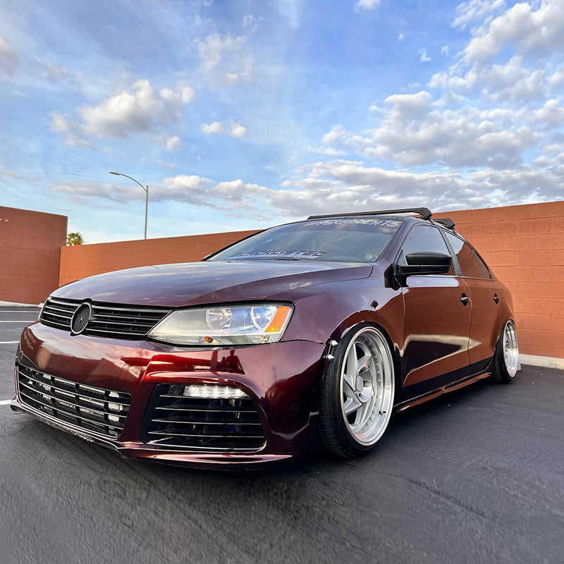 Volkswagen Jetta wrapped in Glossy Metallic Black Rose vinyl wrap